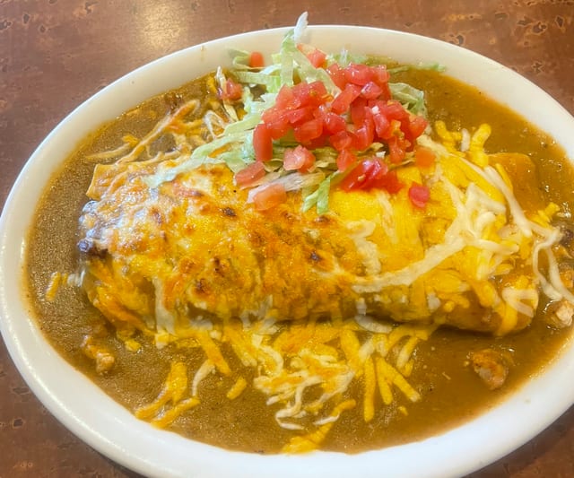 Shredded Chicken And Bean Burrito Smothered.